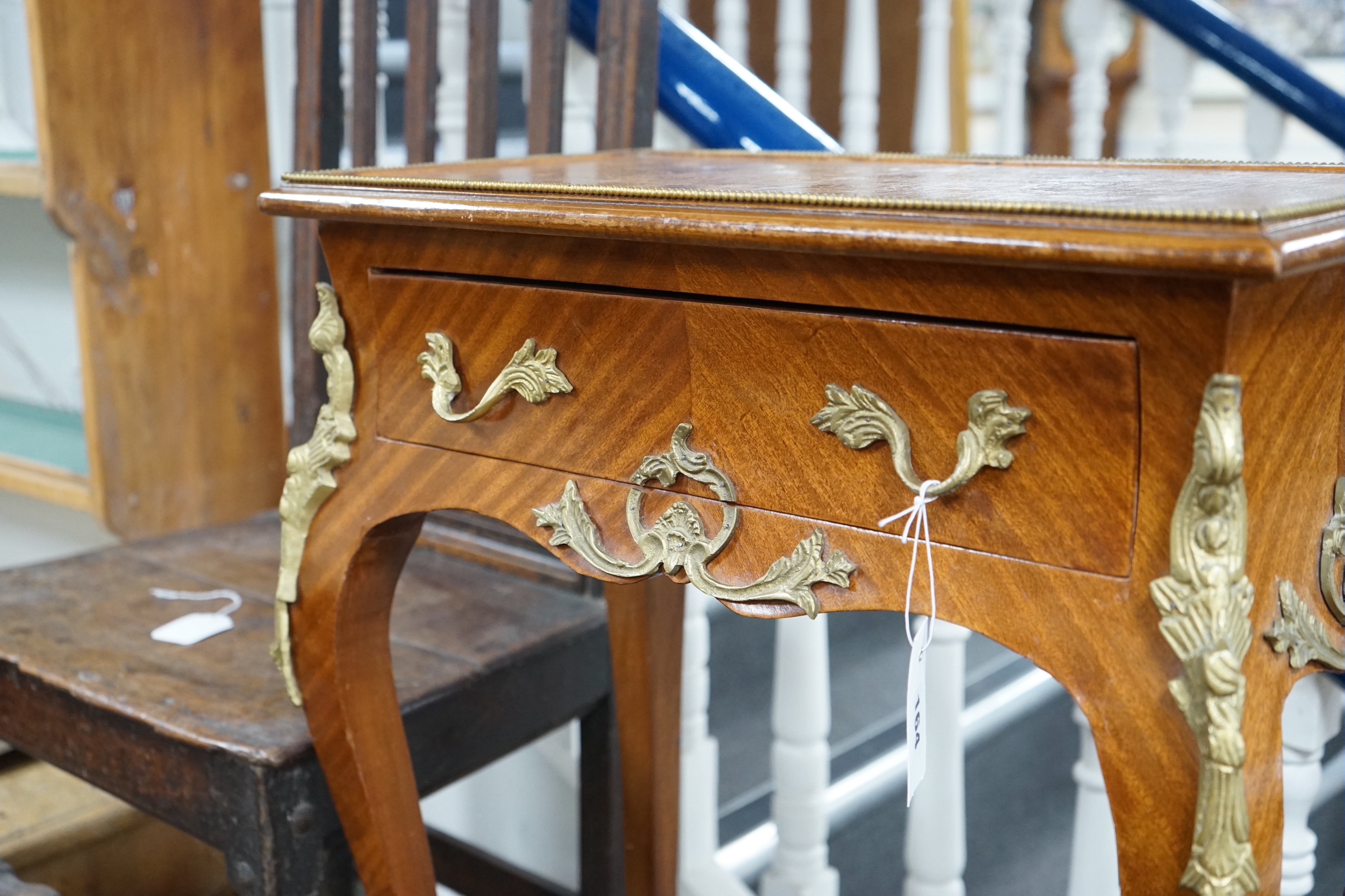 A Louis XVI style gilt metal mounted side table, width 56cm, depth 33cm, height 76cm